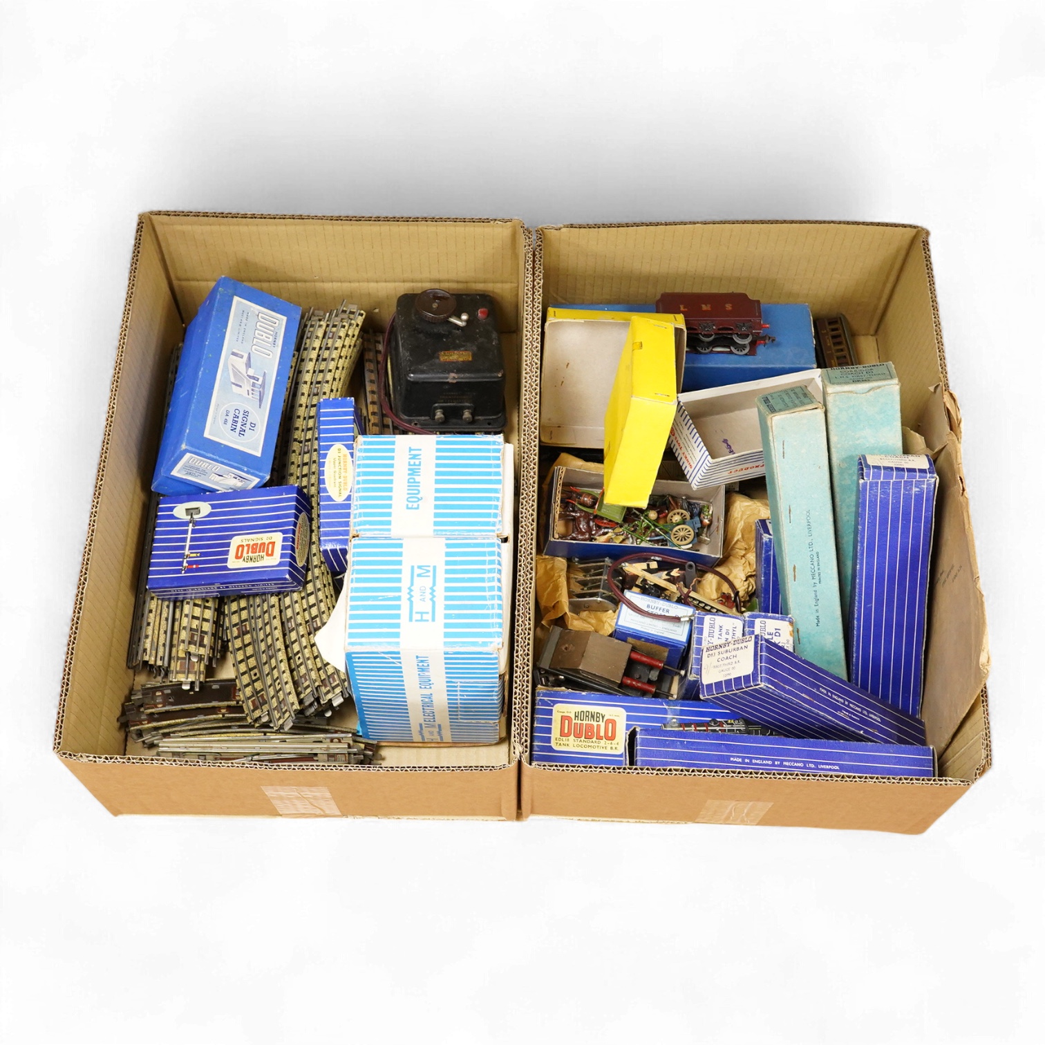 A collection of Hornby Dublo railway for 3-rail running, including two locomotives; an LMS Duchess of Athol 4-6-2, locomotive box, tender unboxed, and a boxed BR Standard Class 4 2-6-4T, 80054, together with five boxed b